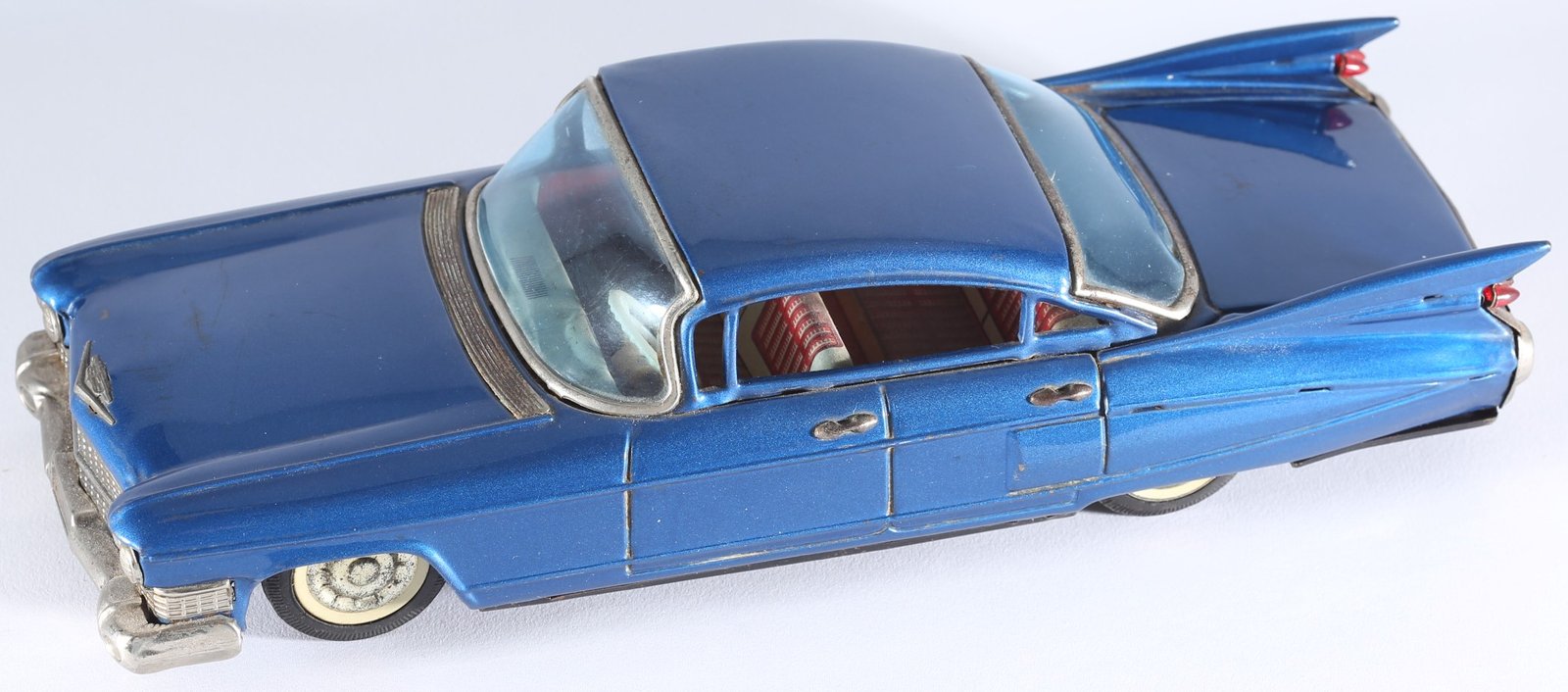 kallistoys auctions auktionen-antique vintage toys-antik historisch spielzeug-bandai-japan-tinplate-blech-car-auto-cadillac four door sedan 1959-shark fins-haiflossen-metallic blue-721-1b