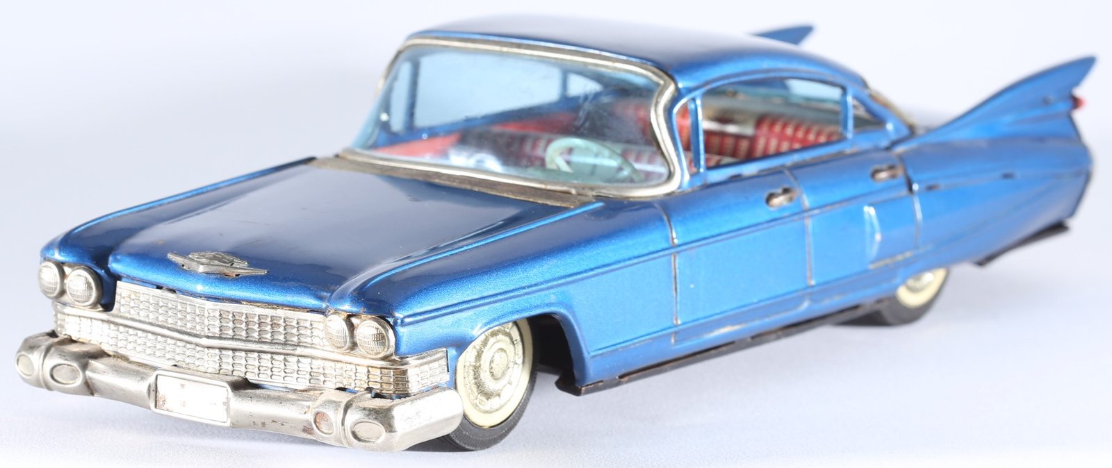 kallistoys auctions auktionen-antique vintage toys-antik historisch spielzeug-bandai-japan-tinplate-blech-car-auto-cadillac four door sedan 1959-shark fins-haiflossen-metallic blue-721-1d