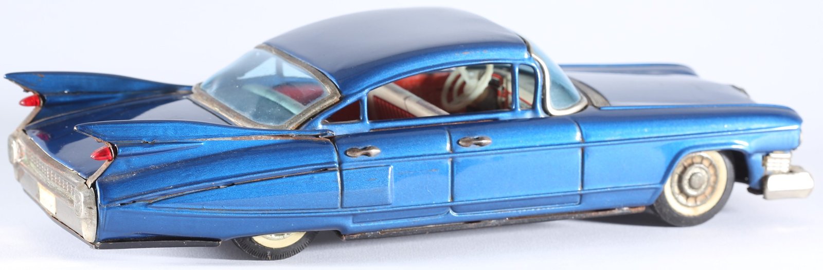 kallistoys auctions auktionen-antique vintage toys-antik historisch spielzeug-bandai-japan-tinplate-blech-car-auto-cadillac four door sedan 1959-shark fins-haiflossen-metallic blue-721-1f
