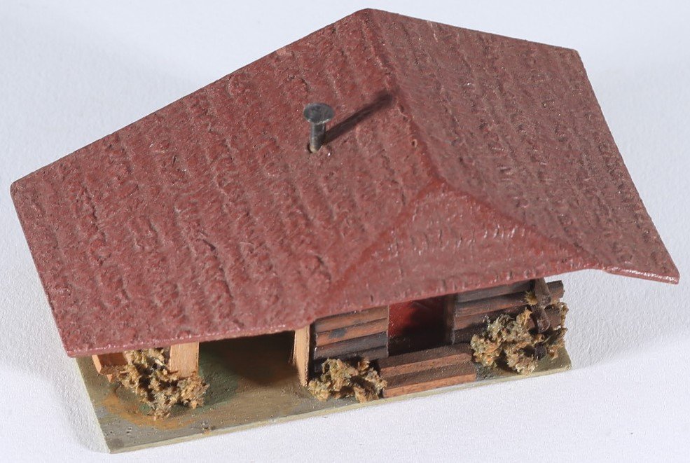 kallistoys auctions auktionen-antique vintage toys-antik historisch spielzeug-faller-germany-wood house-holzhaus-forest hut-waldhütte-gezackte briefmarke-braune nummer-293-1b